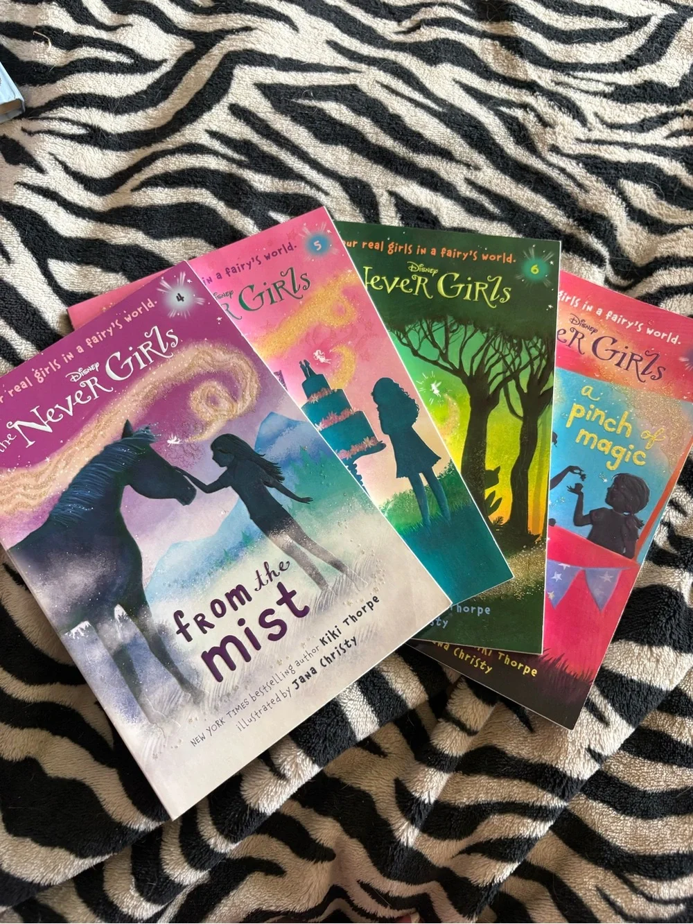 Disney The Never Girls paperback set - pink, teal, green, purple